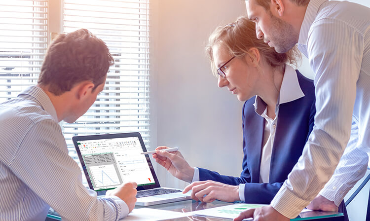 Woman and two men look at laptop screen with Sheetcast