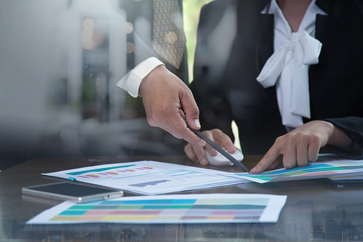 photograph of man and woman picking color swatch printed on paper